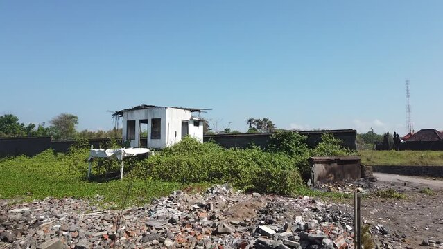 Abandoned White House Near The Beach, Devastated Building Eroded by Wind in Natural Sunny Tropical Beach Landscape with Green Mangroves, Broken Bricks