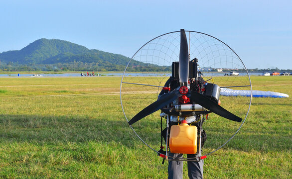 Practice flying a Paramotor in the first time with mountains background 
