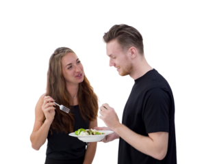 couple eating salad in the kitchen