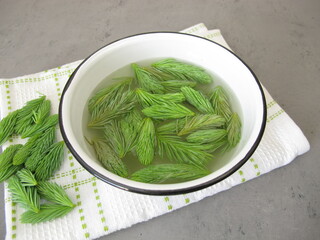 Bath additive with young spruce tips