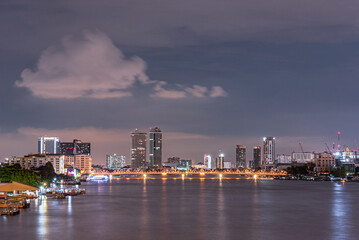 Fototapeta premium Long exposure night land scape at rama VIII bridge, the famous suspension bridge in Thailand , Bangkok, Thailand