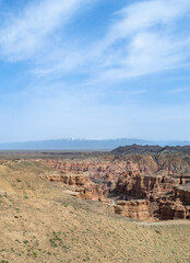 Charyn Canyon - the younger brother of the Grand Canyon
in USA. Brown, red and yellow mountains around. Beautiful views on the gorge.