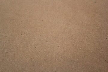 Brown paper texture close detailed background, shiny brown paper surface