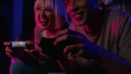 Detail of young caucasian couple playing video game with game pads. Shot with RED helium camera in 8K