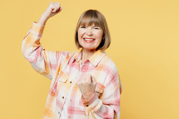 Elderly fun blonde caucasian woman 50s years old she wear casual clothes doing winner gesture...