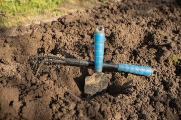 garden tools in the garden. a sunny day