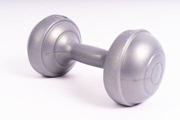 Grey dumbbell Side view closeup isolated on white background