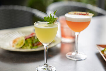 Seafood aperitif served with cutlery and two cocktails