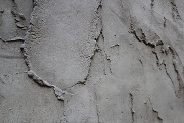 Uneven cement and sand wall texture background, grungy cement wall surface, rustic sand wall