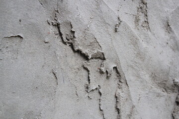 Uneven cement and sand wall texture background, grungy cement wall surface, rustic sand wall