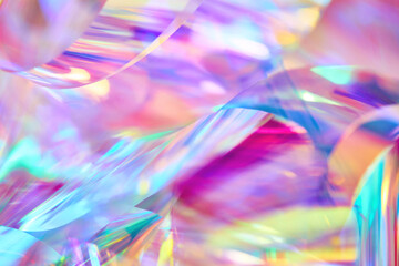 Close-up of ethereal bright neon pink, magenta, orange, blue, purple holographic metallic foil background. Abstract modern curved blurred surreal futuristic disco, rave, techno, festive backdrop