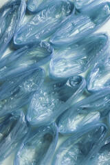 Background from blue used disposable plastic bags for food, texture from Polyethylene packets. Waste reduction, Environmentally friendly concept, recycling, disposable and zero waste
