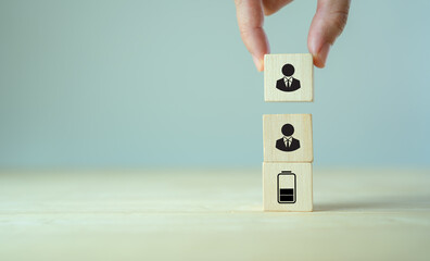 Manpower planning and management concept. Forecasting future staffing needs, analyzing current staffing levels and developing human resource strategies. Wooden blocks with manpower or staffs icons.