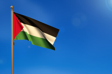 Palestine. Flag blown by the wind with blue sky in the background.