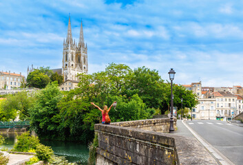 Happy woman in France- Niort city landscape, Deux-Sèvres, Poitou Charente region