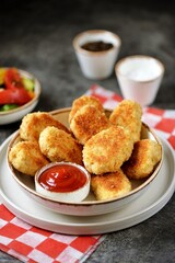 Homemade chicken nuggets fried in olive oil.