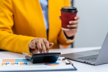 Fototapeta premium Young busy asian business woman manager, lawyer doing bookkeeping audit graph documents checking Bank Reconciliation, Base Stock, Last Invoice Price, Freight, Drop Product or Drop Section Decisions