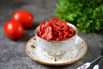 Homemade dried tomato chips with sea salt.