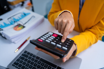Young busy asian business woman manager, lawyer doing bookkeeping audit graph documents checking...