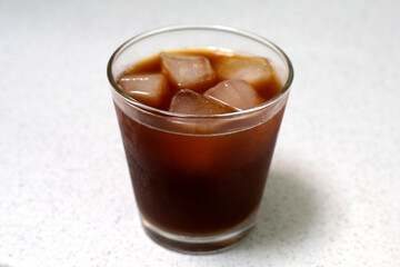 Iced black coffee on white background.