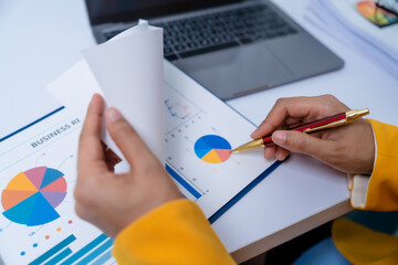 Young busy asian business woman manager, lawyer doing bookkeeping audit graph documents checking Bank Reconciliation, Base Stock, Last Invoice Price, Freight, Drop Product or Drop Section Decisions