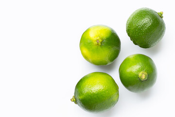 Limes with on white background. Copy space