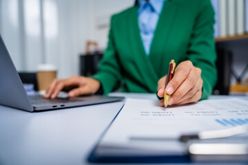 Young busy asian business woman manager, lawyer doing bookkeeping audit graph documents checking Bank Reconciliation, Base Stock, Last Invoice Price, Freight, Drop Product or Drop Section Decisions
