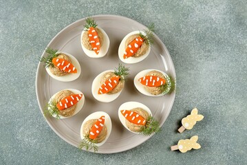 Stuffed eggs with liver pate in the form of carrots