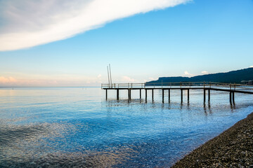Mediterranean Sea near Kemer. Landscape in Turkey. Nature on the beach with a jetty in the background.
