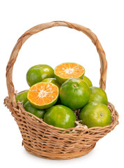 Green Oranges in bamboo basket on white background, Tangerines Oranges Idolate on white with clipping path.