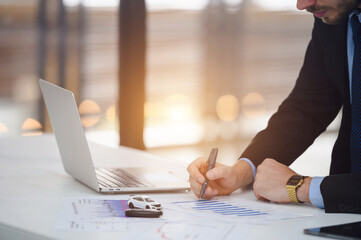 Businessman looking at contract or agreement Buy or sell a new car Salesman signs car insurance...