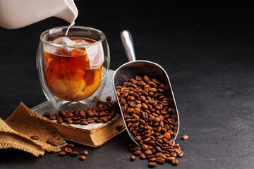 Iced cold brew coffee and freshly roasted coffee beans