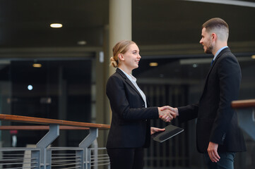 Portrait of Happy smiling business woman handshake with business man Business mergers and acquisitions image of business people handshake to teamwork