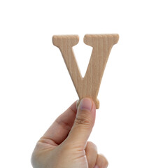 Hand holding wooden letter V
