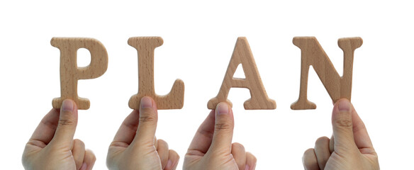 Hands holding wooden word plan
