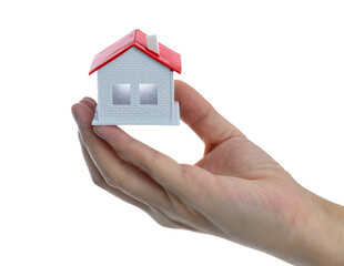 Human hand holding model house