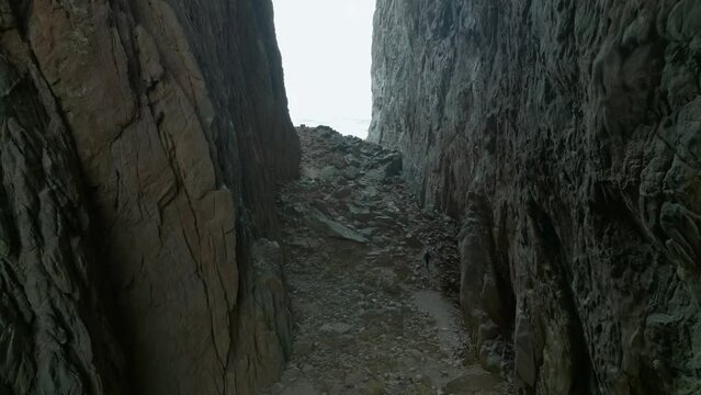 Torghatten in Norway person walking inside the hole