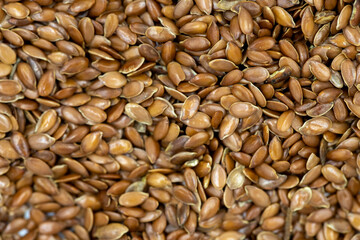 Flax seeds background or texture. Flaxseed or linseed. Cereals. Healthy food. Close up