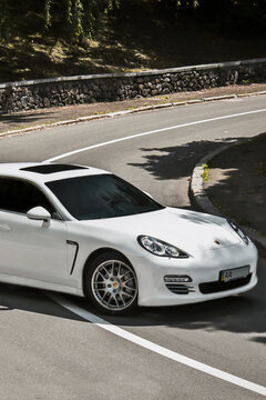Kyiv, Ukraine - June 1, 2013: White luxury car Porsche Panamera 4S on the road