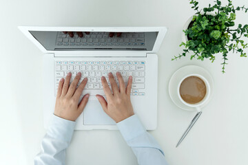 Woman hand tying on laptop keyboard