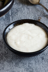 Bechamel sauce in a bowl. Homemade white sauce dip.