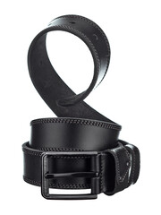 Beautiful leather belt made of black rawhide, with a metal buckle, beautifully twisted into a spiral, isolated on a white background. - 605946586