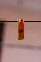 Close-up of a cloth clip hanging on a rope