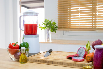 Counter with blender and vegetables.