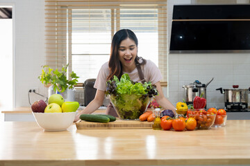 Woman happy with vegetables in the bowl for cooking.