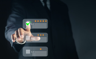 Customer or User give rating to service experiences review feedback survey on online application, Businessmen are choosing screen on the happy Smiley face icon to give satisfaction in service.