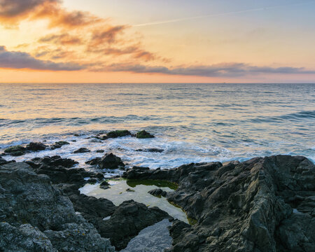 seascape at sunrise. vacation season background. rocks on the shore in morning light
