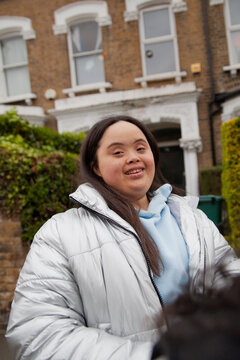 Portrait of mixed-race girl with Down Syndrome
