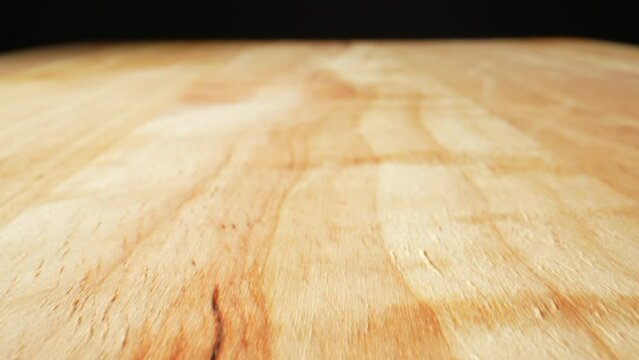 Macro video with a probe lens showcases the mesmerizing wood texture of a chopping board, revealing intricate lines, grains, and patterns in rich colors. Shot with Laowa 24mm Probe Macro Lens. HDR
