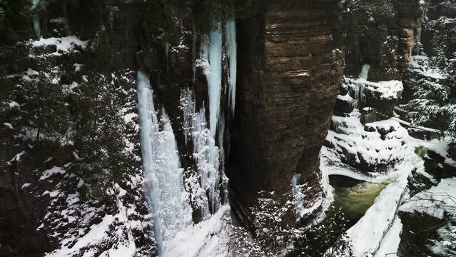 Snow-Covered Cliffs Of Ausable Chasm In New York, USA. Pan Right Shot